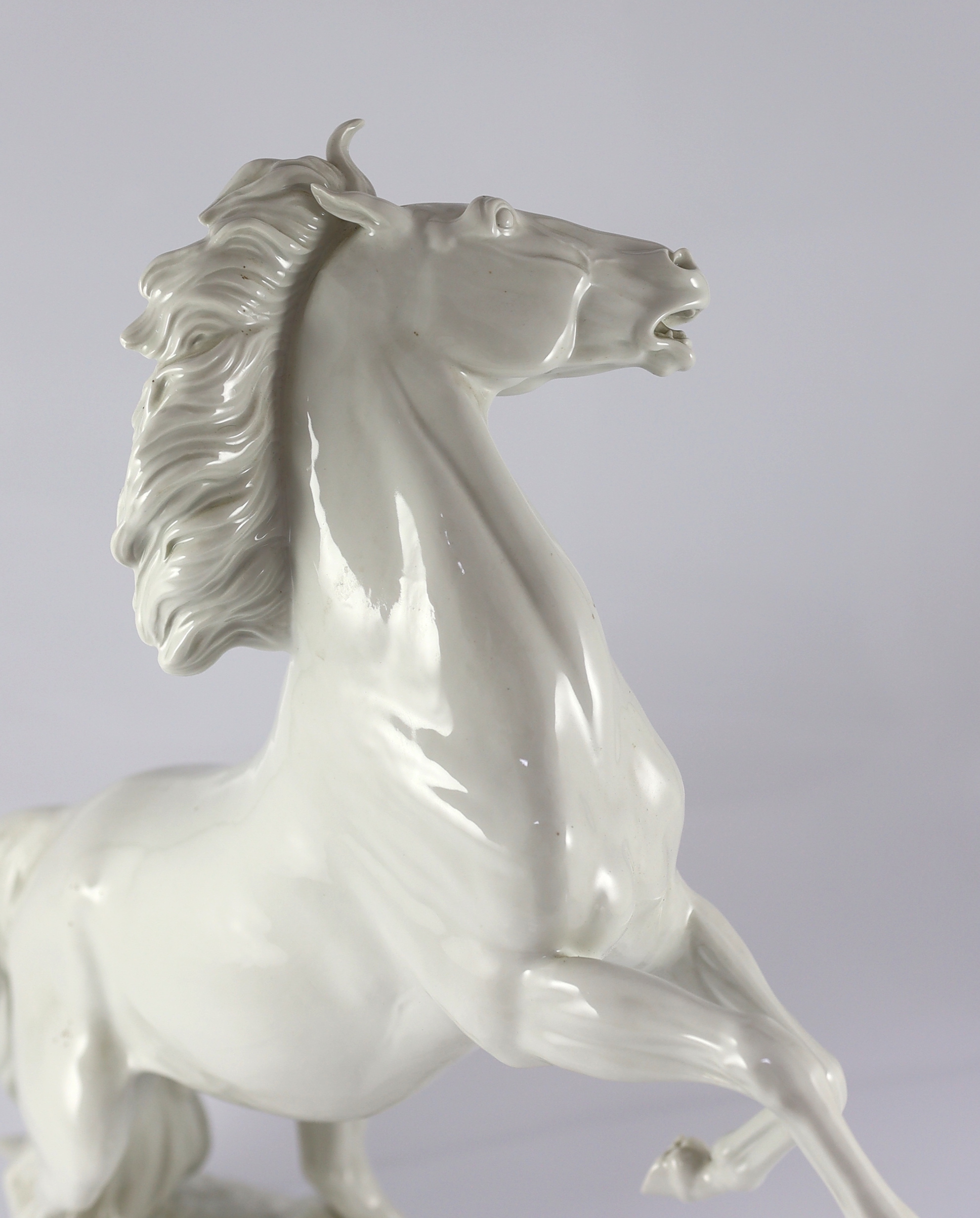 A large Meissen figure of a rearing stallion modelled by Eric Oehme, c.1949